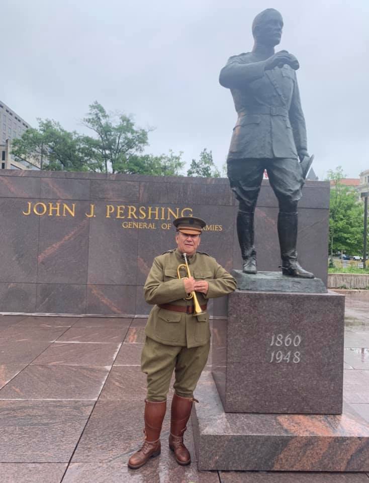 Jari Villanueva in front of the Pershing monument