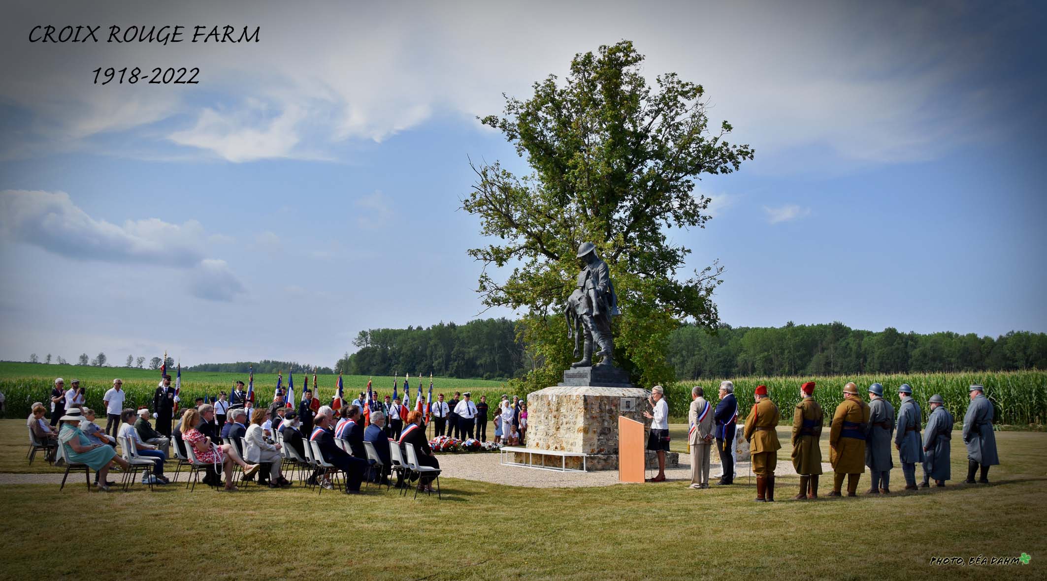 Another angle of soldiers, delegates, and reenactors at a WWI memorial