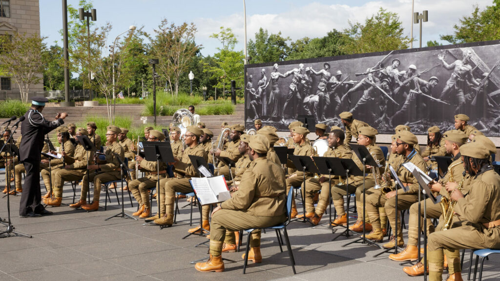 Reenactors of the 369th band perform at the WWI memorial