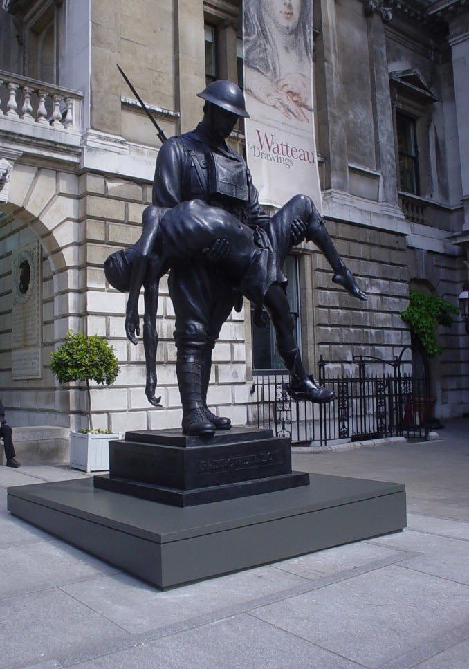Statue in front of a stone building