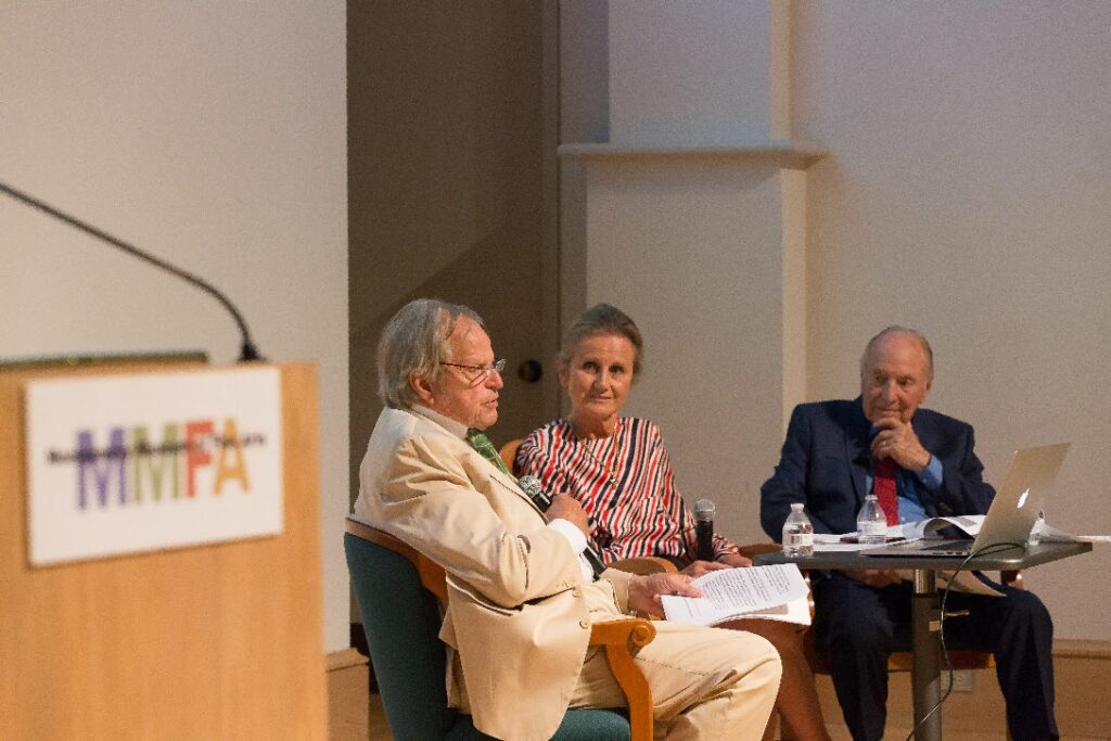 Three people at a roundtable discussion