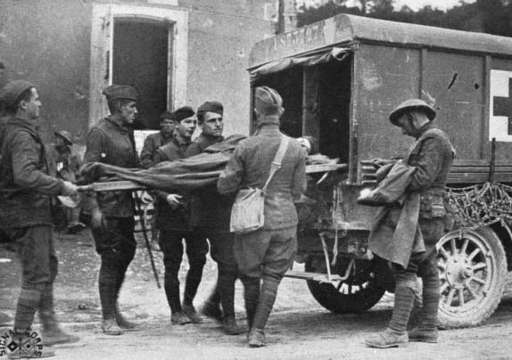 WWI soldiers unloading a wounded soldier on a gurney