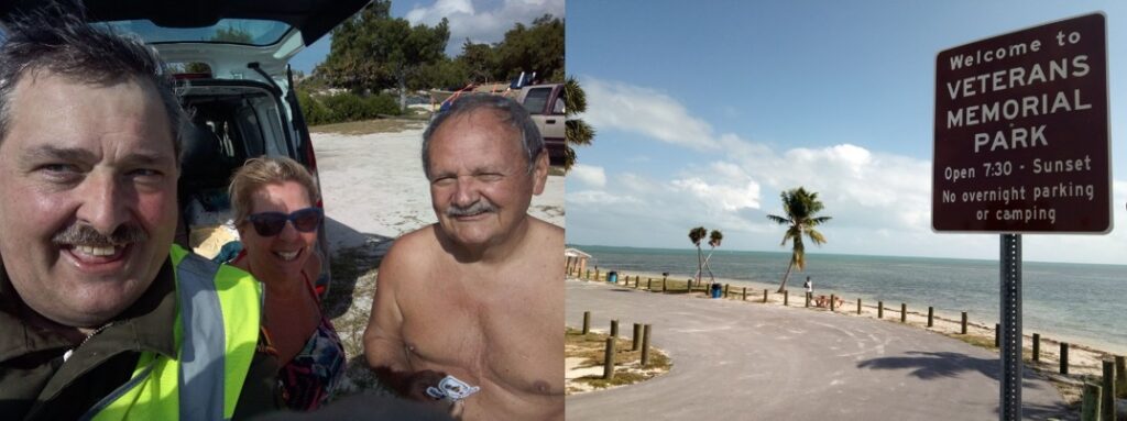 Three people at the beach and a sign for a Memorial Park