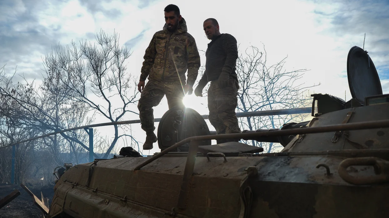 ukrainian-bmp-crew-stands-on-top-of-their-vehicle-outside-the-city-of-avdiivka