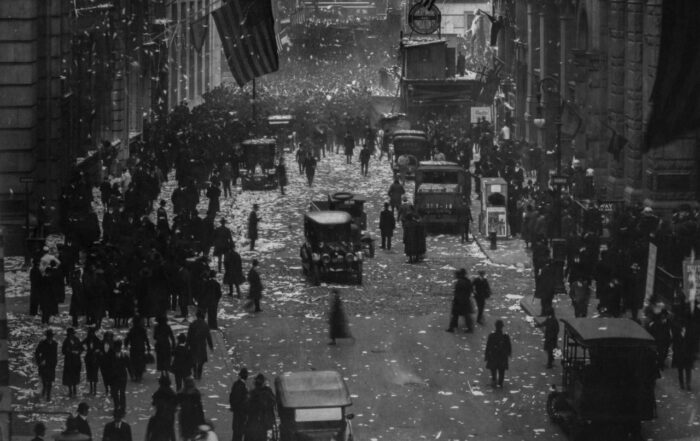 People on the street after World War I, New York City, NY