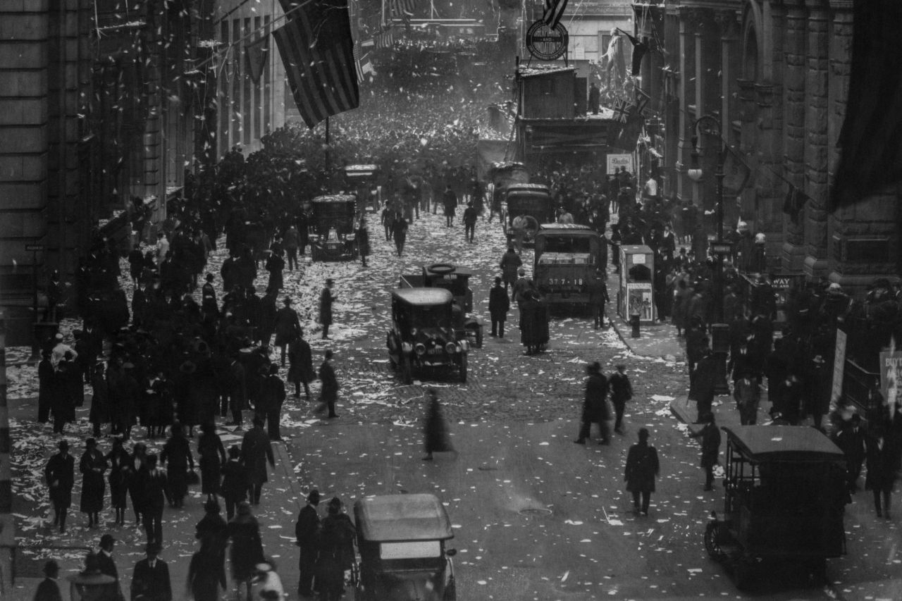 People on the street after World War I, New York City, NY